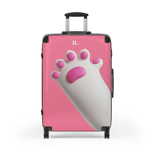 Custom hard-shell suitcases in pink background with dog paw